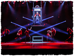 a performer in a cage