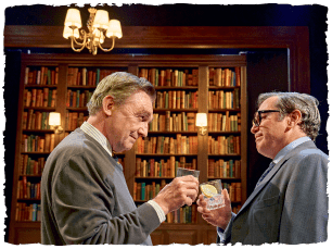 2 men cheersing glasses