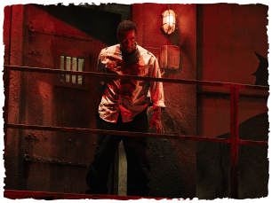 Red lighting, a man looking angry