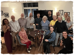 Group of people smiling for pic in stalls bar