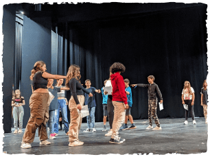 Young people performing in rehearsal space