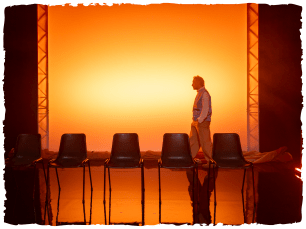 4 plastic chairs with a warm glow of light