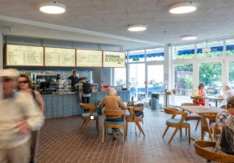 Interior of cafe with peoplel in it