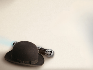 A bowler hat and a lightsaber against a cream background