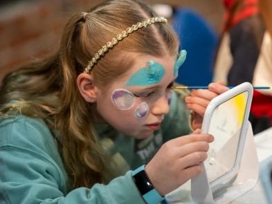Young girl with blue special effects make up on
