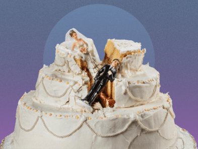 A bride and groom figurine in a crumpled wedding cake