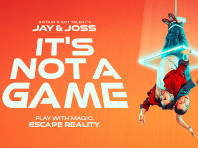 It's Not A game artwork. Orange background with two people dangling down from ceiling