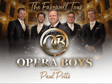 5 men in suits inside an opera house