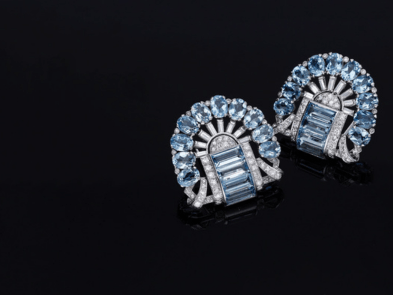 Diamond blue earrings on a black background