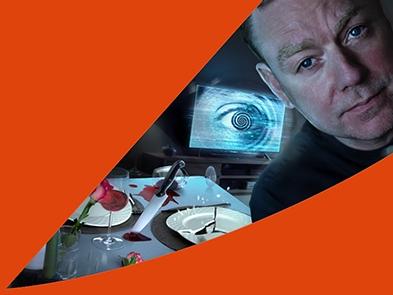Rufus Hound and an orange swish at the top and bottom of the image