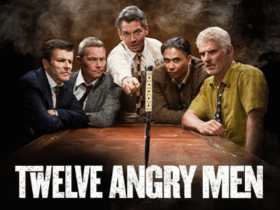5 men round a table 