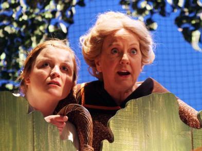 Production photo from Cider with Rosie in 2013 of a young performer next to an adult performer